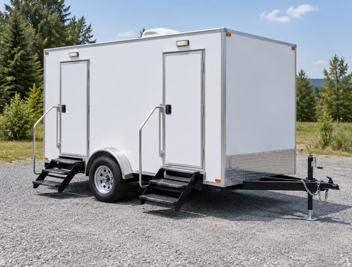 Compact two-stall restroom trailer with two exterior doors