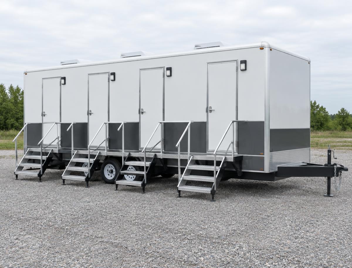 Four-stall restroom trailer with four entrances and shared deck