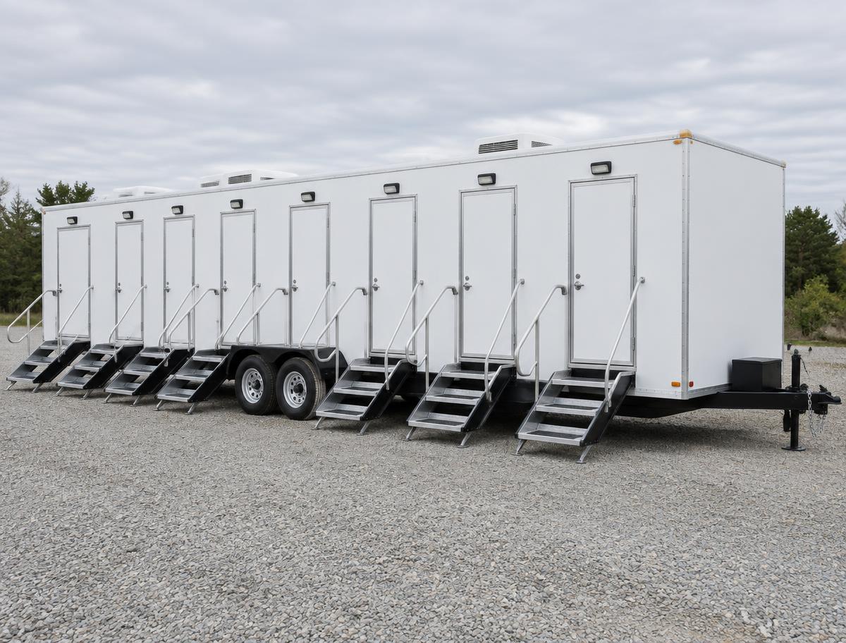 Long eight-stall restroom trailer with eight exterior entrances